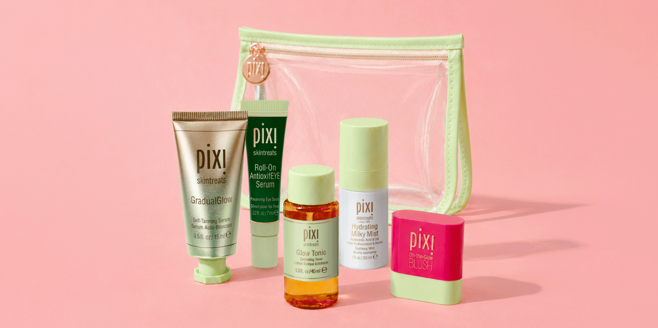 GradualGlow, Roll-On AntioxifEYE Serum, Glow Tonic, Hydrating Milky Mist and On-the-Glow Blush in petite sizes shown on a pink background with Clear Travel Bag - View 3