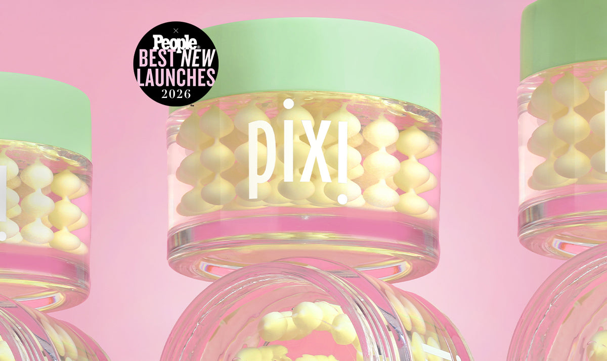 Pixi clear jars filled with pale yellow cream beads, topped with mint green lids, arranged on a pink background with a People Best New Launches 2026 badge.