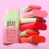 Pixi On-the-Glow Blush sticks in assorted colors against a pink background