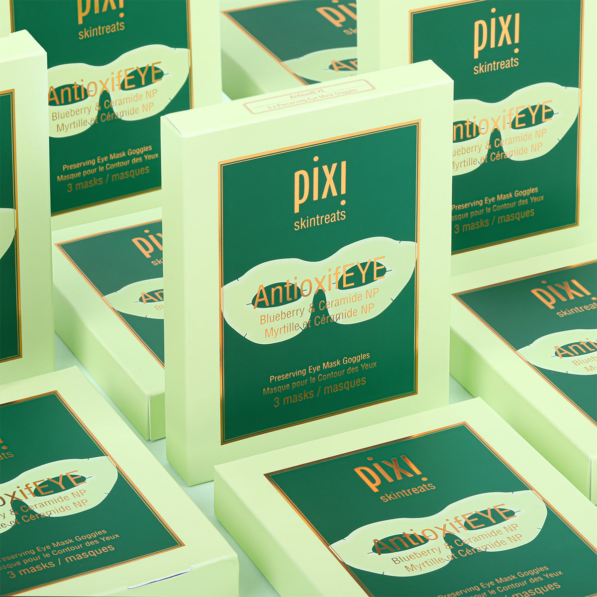 Multiple boxes of Pixi AntioxifEye skincare product on a light green background