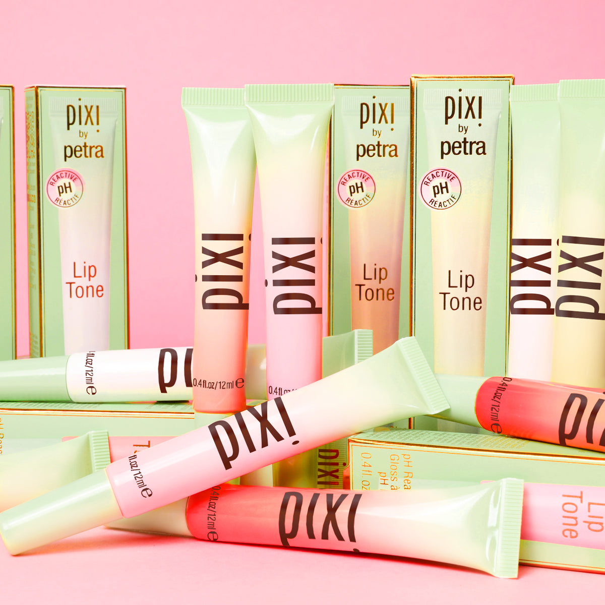 LipTone all shades shown on a pink background alongside box packaging